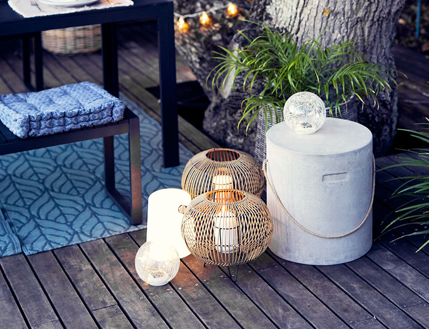 Garden lanterns and solar lamps on patio