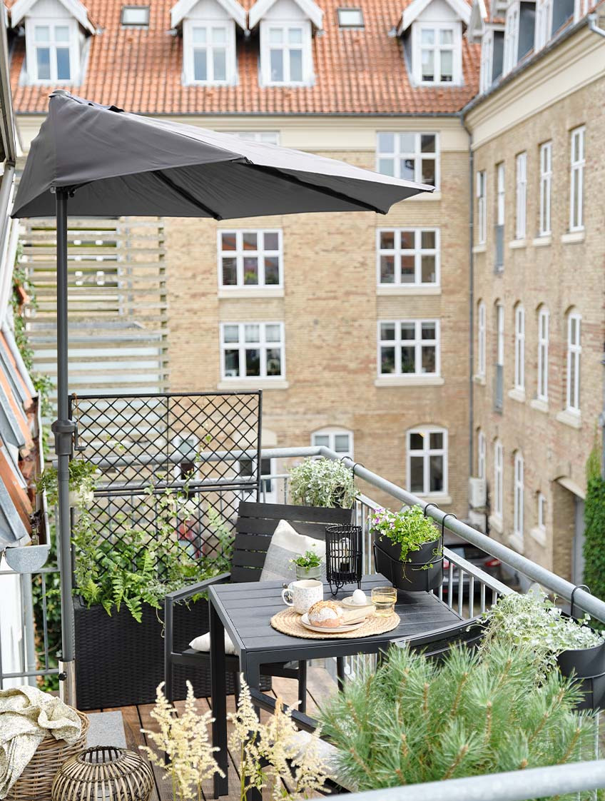 Balcony parasol on balcony with bistro set 