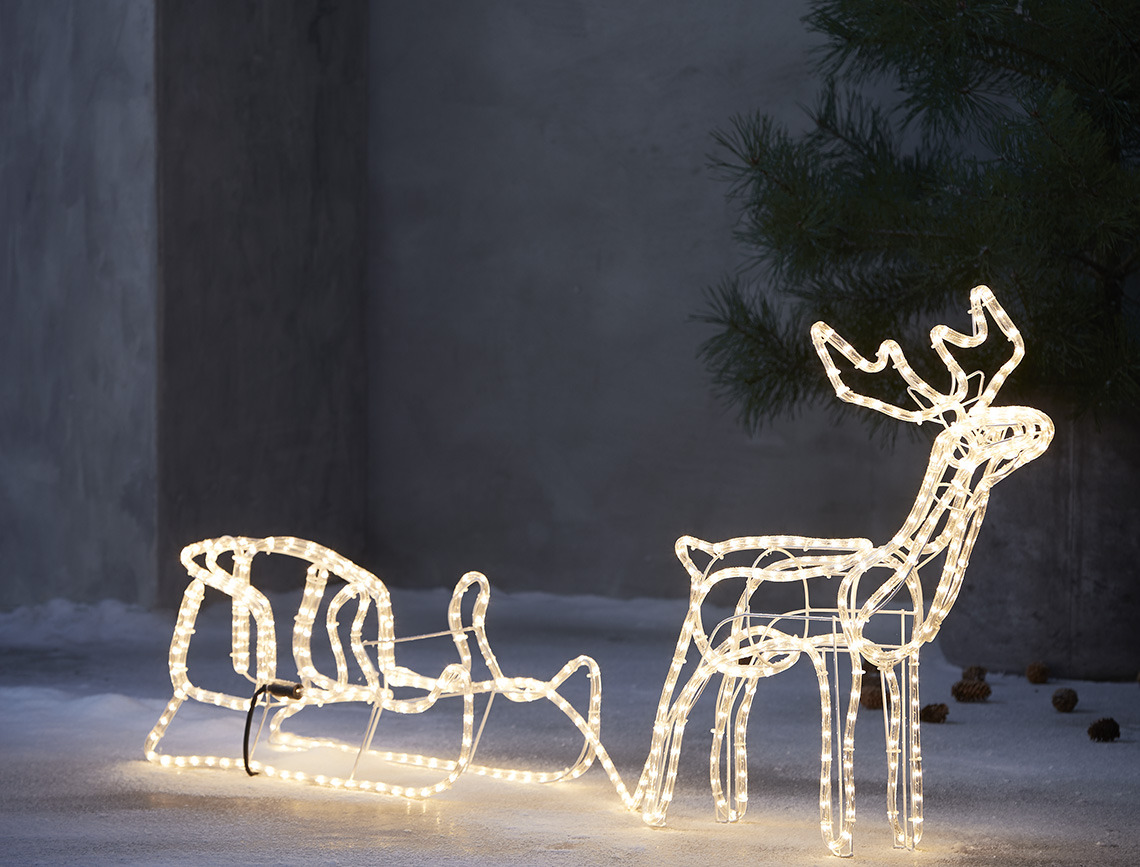 Christmas lights in the shape of an outdoor reindeer with sledge