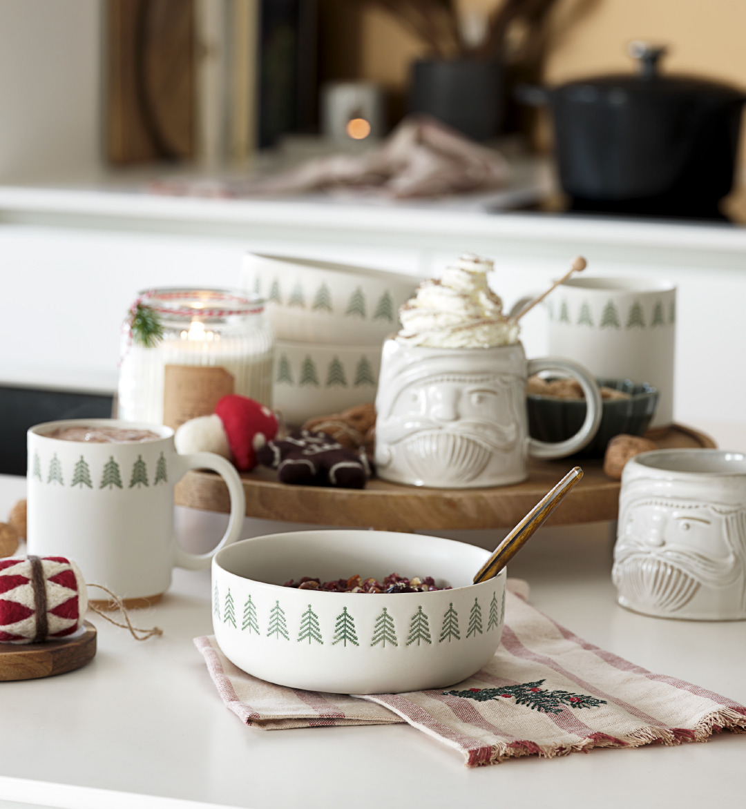 Christmas tableware with a bowl & mugs, accompanied by a kitchen towel 