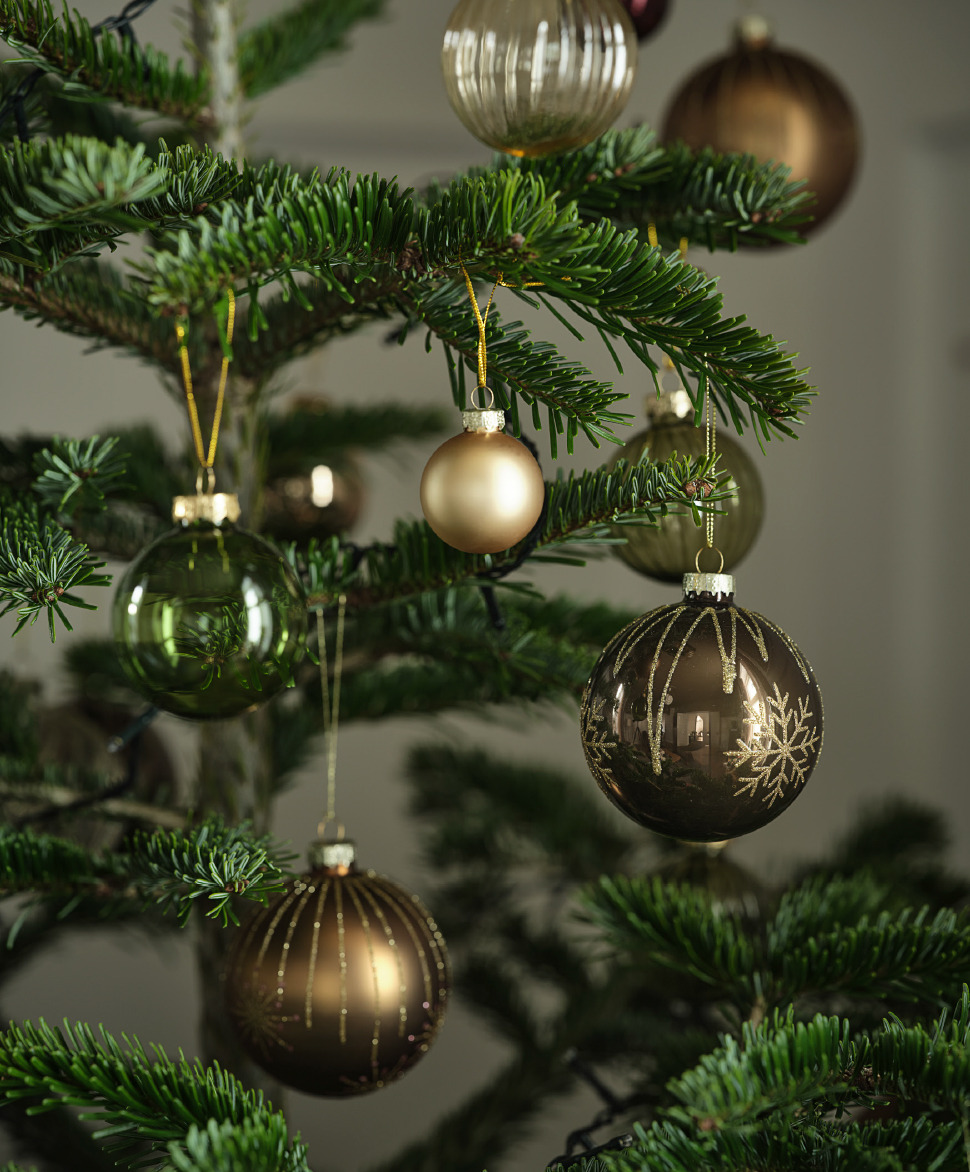 A Christmas tree decorated with glittery baubles