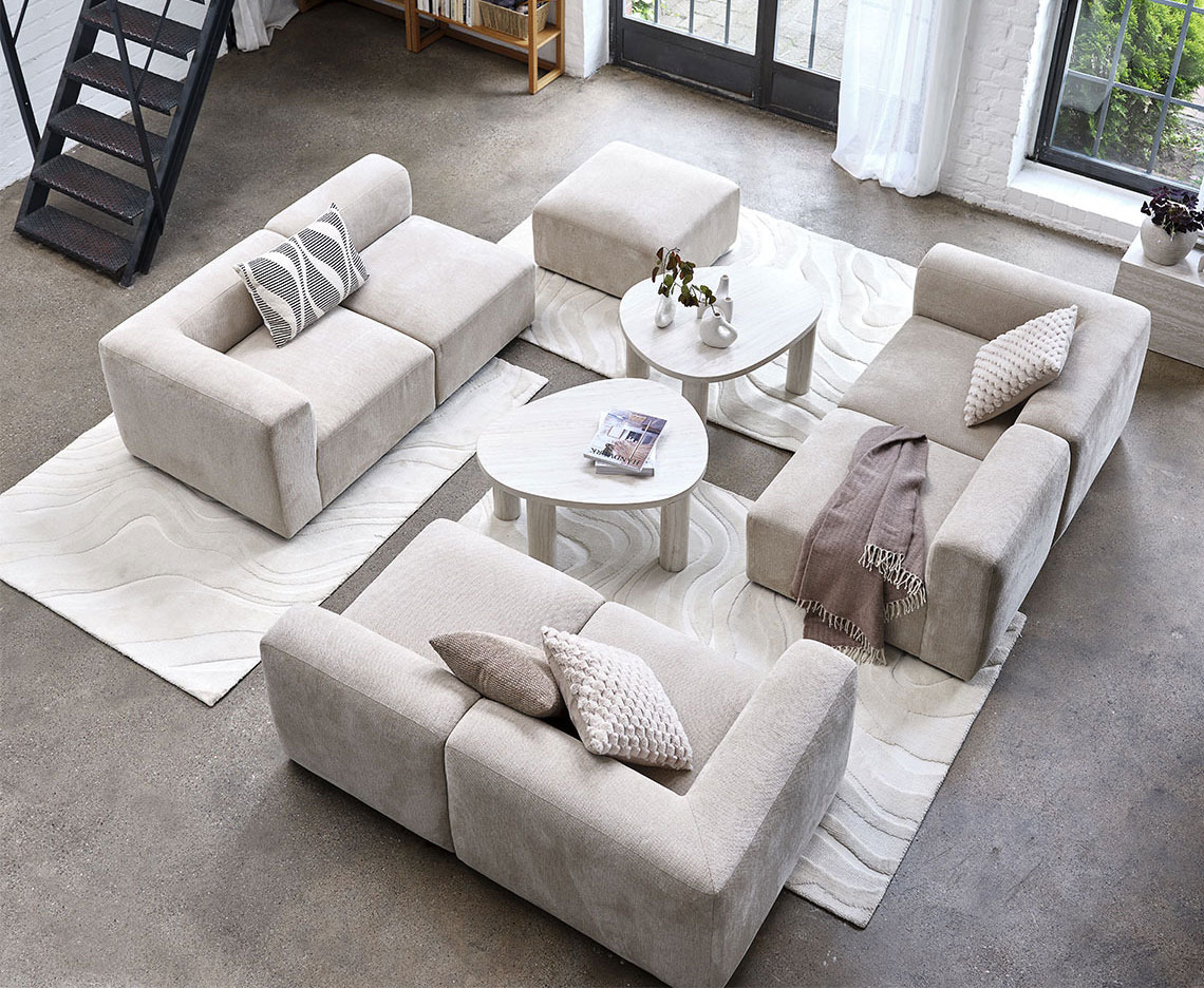 Beige modular sofa centralised in a large living area