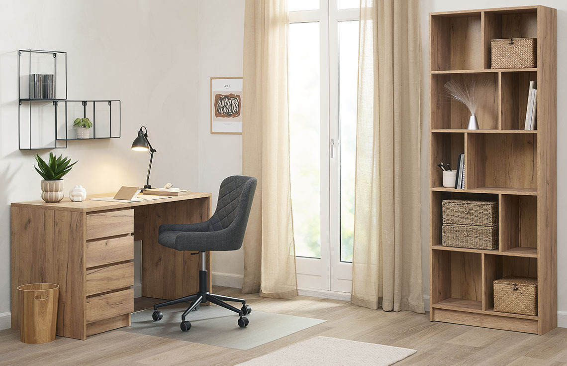 Home office setup with desk, elegant desk chair and bookcase