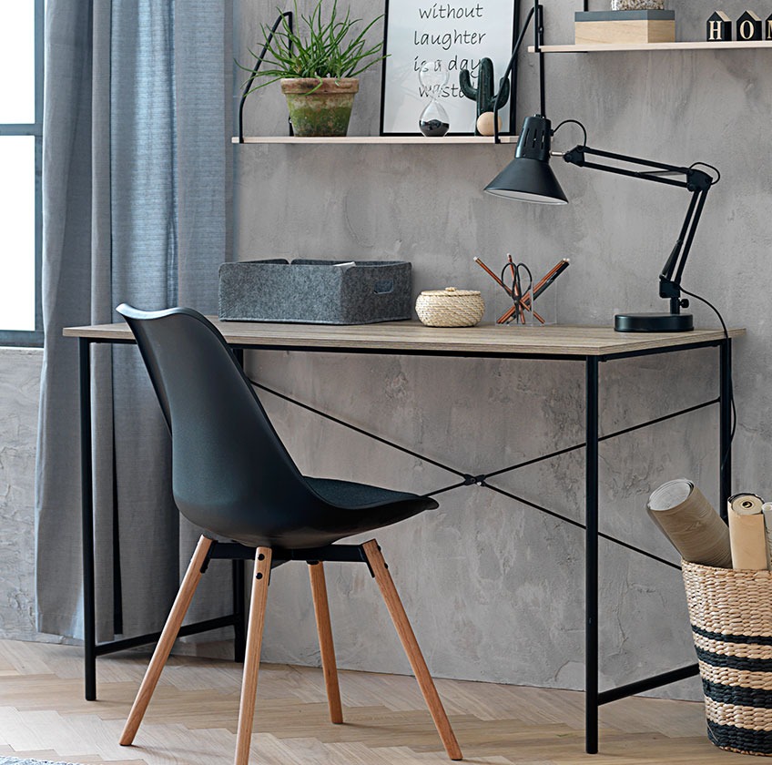 Desk and dining chair by a grey wall